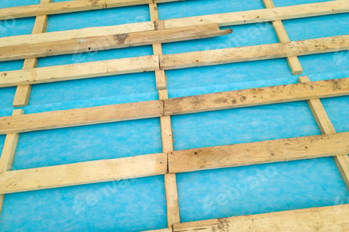 Preview: Top down detail of a wooden roof frame on a house under construction.