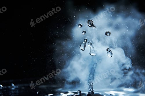 Preview: Boiling water splash with steam on black background closeup