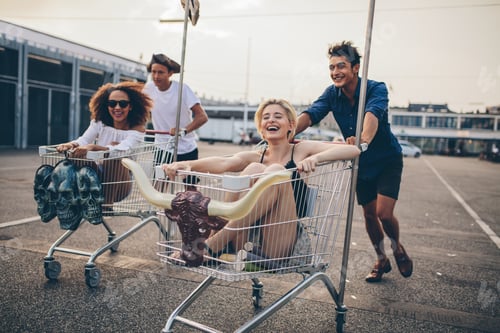 Preview: Young people racing with shopping trolleys