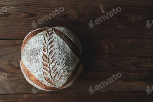 Preview: Black fresh bread with dark background