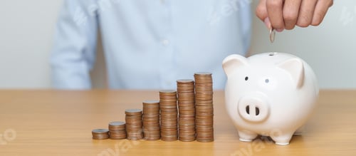 Preview: Saving money with a piggy bank and coins