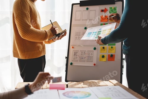 Preview: Ux ui designers come up with new ideas at a meeting to present in office mobile internet software