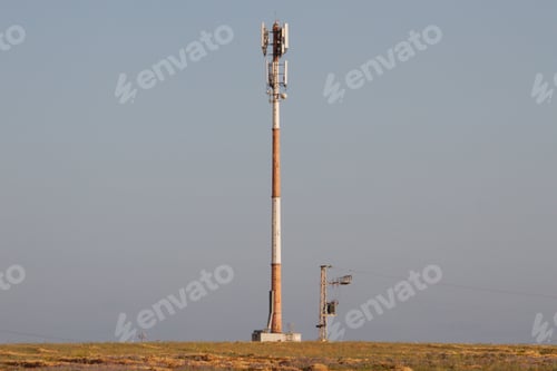 Preview: Automated weather observation system in the field on blue sky background
