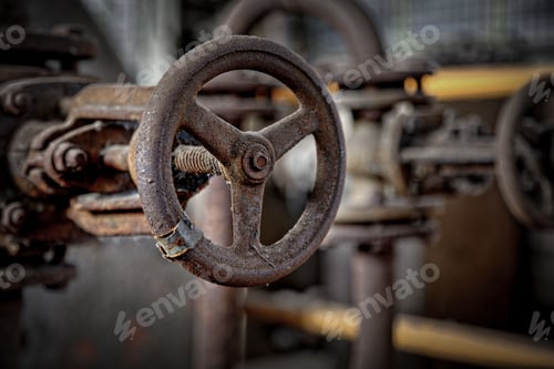 Preview: Selective focus shot of an old rusty metallic steering wheel