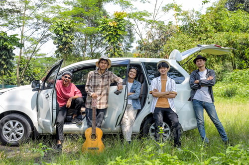 Preview: Group of Asian Men Posing Near Car on Nature. Road Trip Concept.