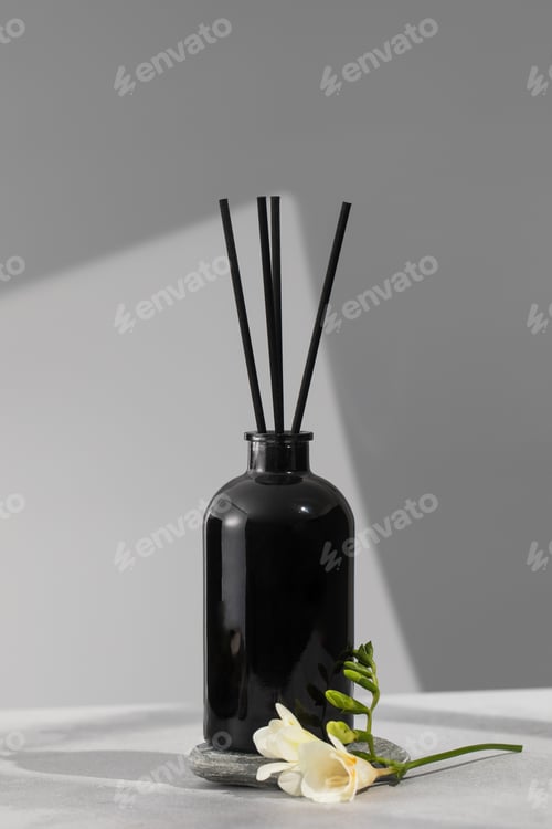 Preview: Black glass diffuser with the scent of flowers. The concept of home comfort, perfumes for the room.