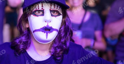 Preview: kid wearing scary mask at Halloween party