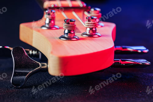 Preview: Guitar headstock with tuners on dark background