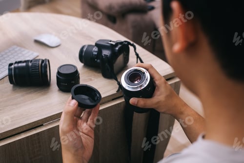 Preview: Photographer Holding Camera Lens