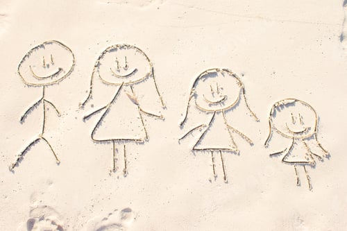 Preview: Family symbol drawn on beach white sand