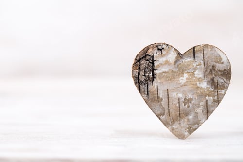 Preview: Valentines day greeting card. Wood heart on the light background.