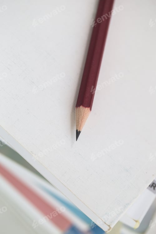 Preview: A pencil and notebook isolated on a white background