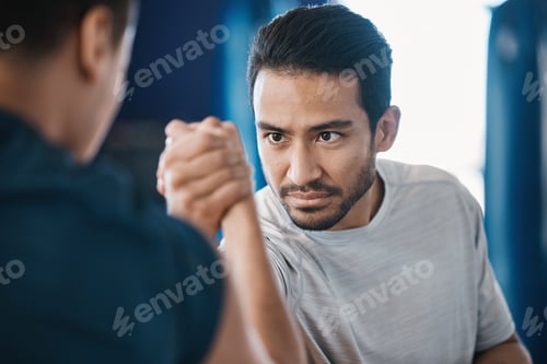 Preview: Arm wrestling, men and strength challenge with strong muscle at a gym for battle. Hand wrestle, pow