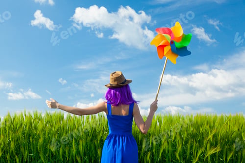 Preview: young woman with wind toy
