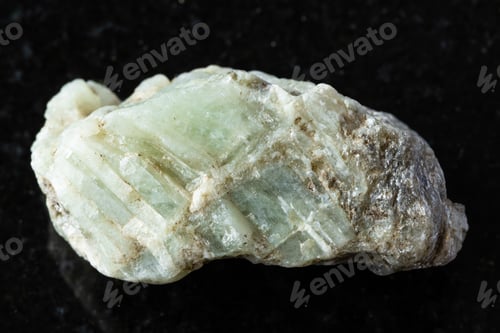 Preview: sample of raw beryl mineral on black granite