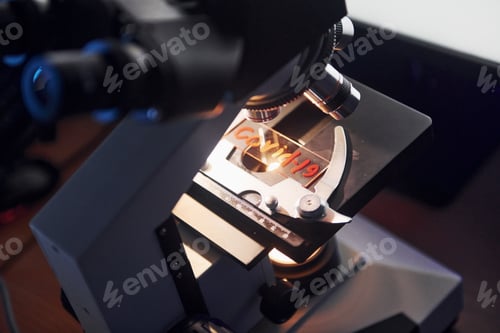 Preview: Close up view of scientist in protective uniform that works with coronavirus in laboratory