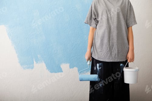 Preview: Girl with paint roller and bucket makes repairs