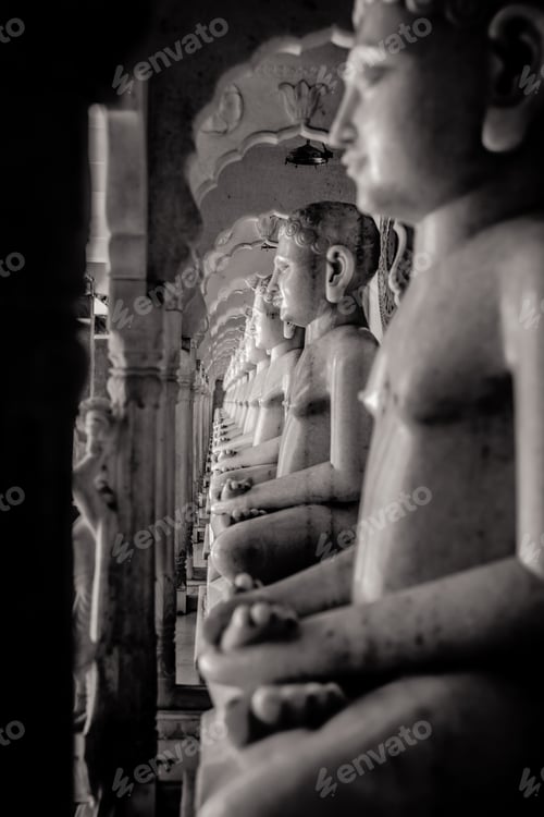 Preview: Buddha statues seated on pillars in a temple in Mumbai