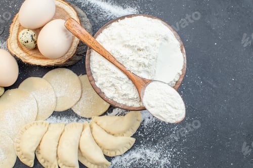 Preview: top view raw potato hotcakes with eggs and flour on dark background meal pie biscuit oven cake bake