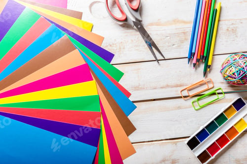 Preview: School tools. On a wooden background.