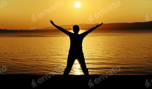 Preview: Person Enjoying Freedom At Sunset By The Sea at Sunset