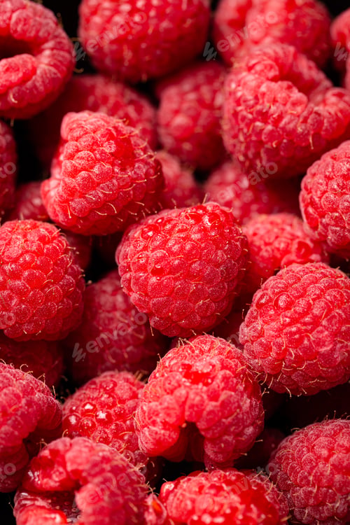 Preview: Closeup shot of cute fresh raspberries one on another