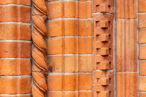 Preview: Brick work wall with ornament on old building. Red brick wall texture architecture background.