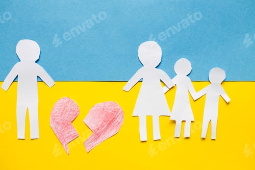 Preview: paper cut divided family on the background of the ukrainian flag. stop war concept