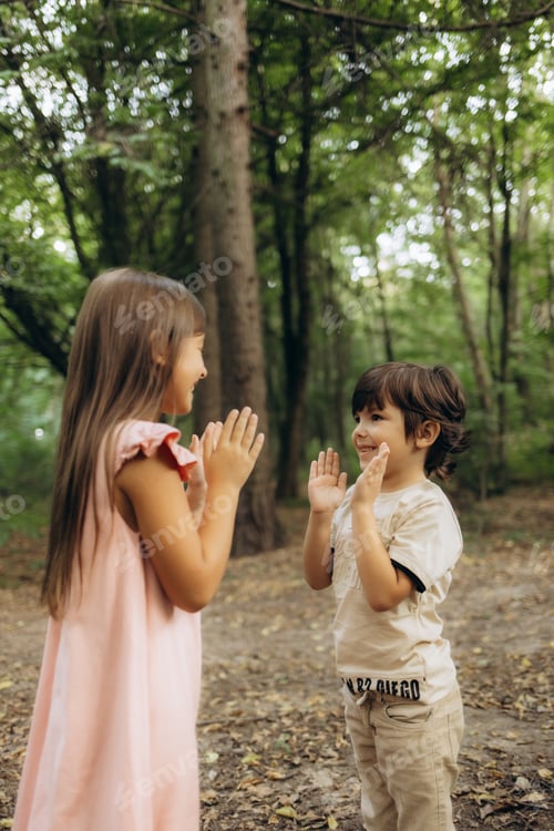 Preview: Brother and sister playing in the forest