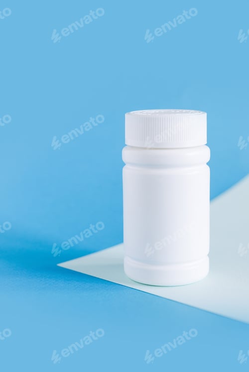 Preview: white medicine bottle mockup on blue background, pill bottles without label design, copy space