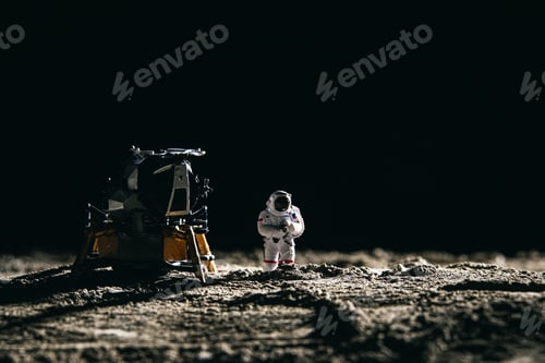 Preview: Astronaut miniature toy next to a spaceship on the moon