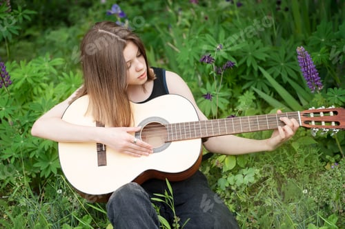 Preview: Teenager Girl Playing Guitar