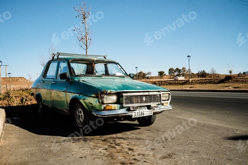 Preview: Marrakesh, Morocco - 31 December 2017: Old green car on roadside