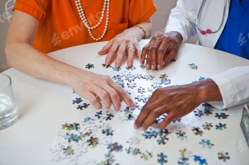Preview: Senior friends enjoying a puzzle together.