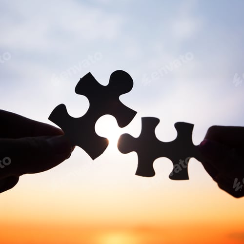 Preview: Two hands trying to connect puzzle pieces