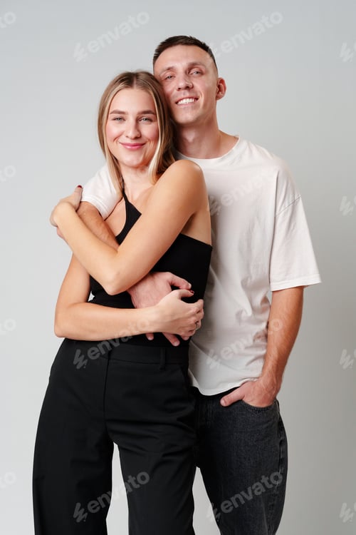 Preview: A Man and a Woman Standing Next to Each Other in studio