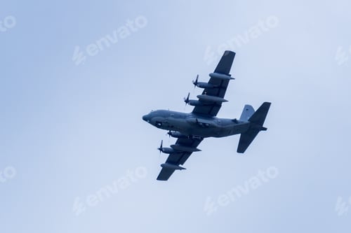 Preview: Large military airplane flying low, California