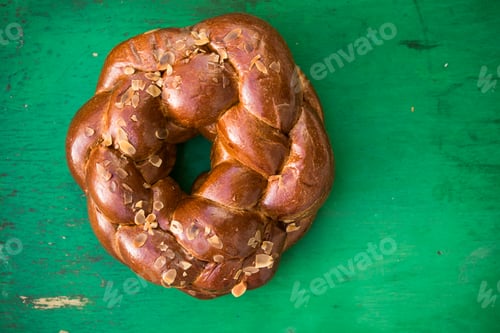 Preview: Tsoureki traditional baked Greek Easter sweet bread, with a boiled red dyed egg in the middle