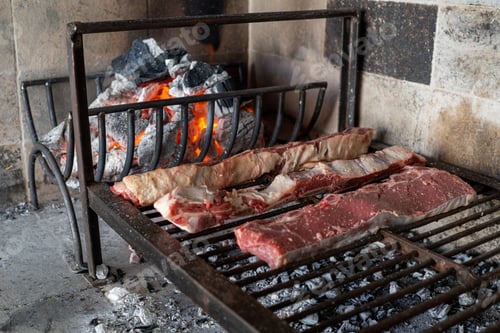 Preview: Process of preparing a typical Argentinian Asado with beef and sausage