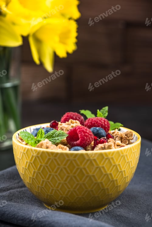 Preview: Breakfast bowl with granola,milk and berry fruits