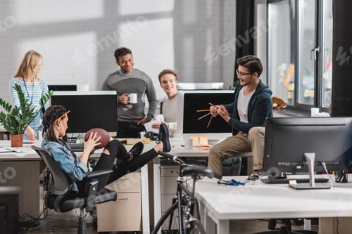 Preview: happy colleagues having fun at modern office