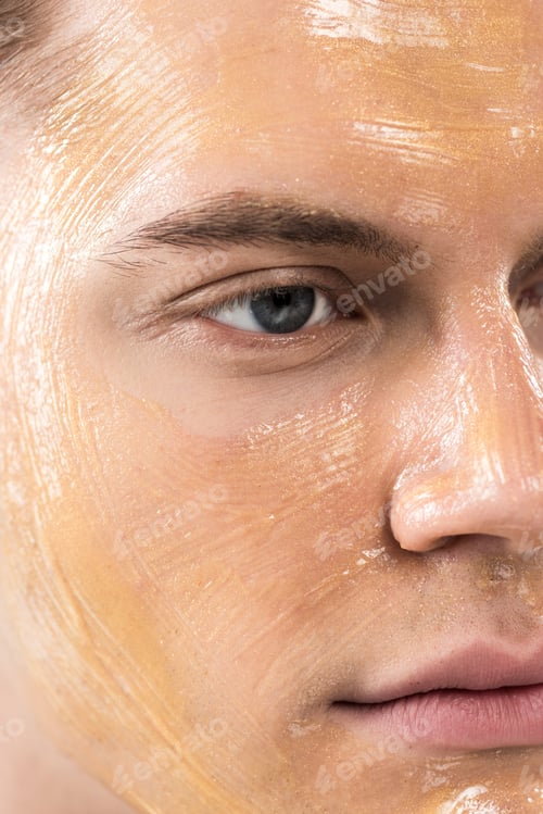 Preview: close up view of young man with facial mask