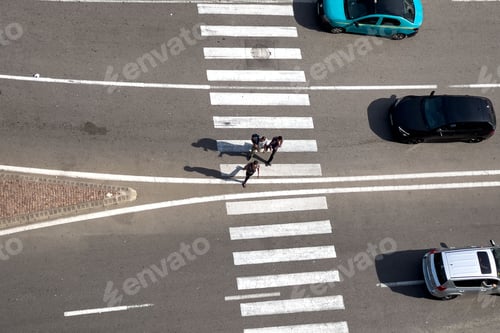 Preview: Aerial view of Pedestrians crossing the zebra lines