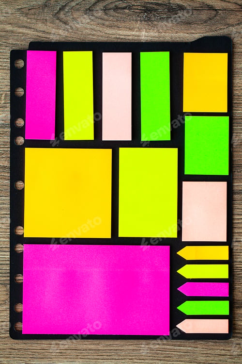 Preview: Blank colorful sticky notes on wood background.