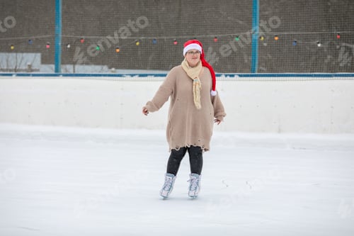 Woman in Santa Hat Ice Skating Outdoors