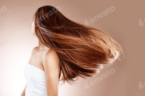 Preview: Beauty, skincare and hair care of woman in studio on a brown background. Hairstyle, cosmetics and a