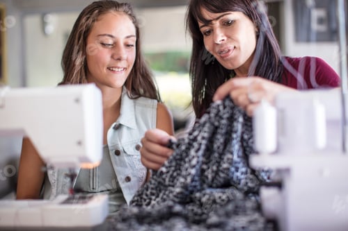 Preview: Mother and daughter sewing together