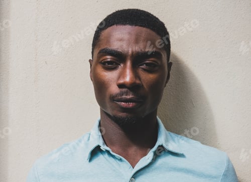 Preview: Close up young African American man with serious face expression