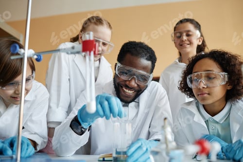 Preview: Teacher And Kids Doing Lab Experiment
