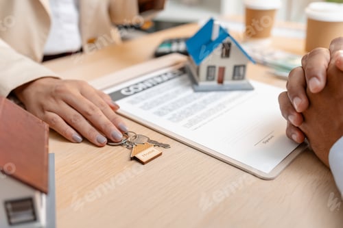 Preview: A real estate agent presents a property sale contract to a client